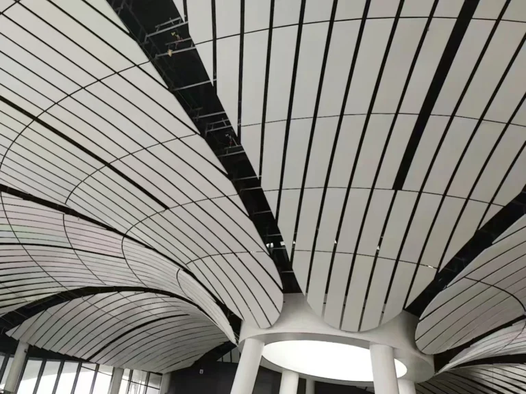 Customized curved ceiling panel for commercial space