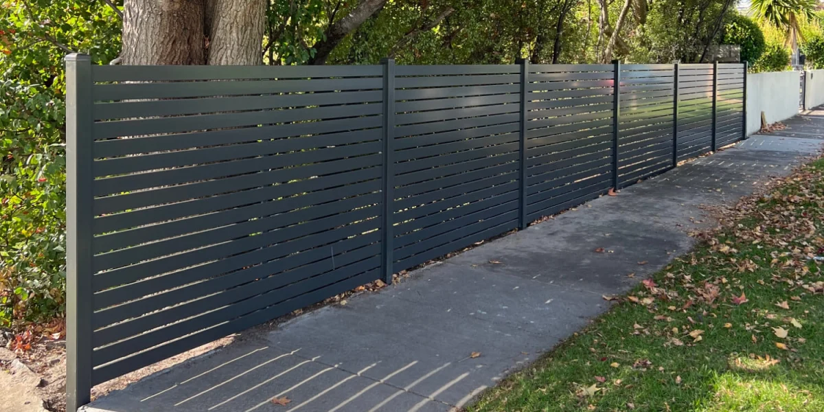 Aluminium Fencing Profiles 02 Aluminium slot fencing with dark grey installed in garden