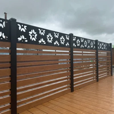 Modular fencing in wood grain matched with decorative carved panel in balcony