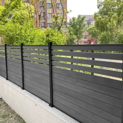 Aluminium modular fencing with gapping in walnut finish applied in private yard