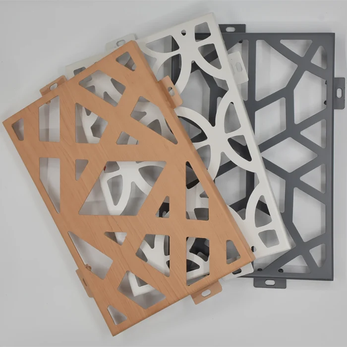 Close-up of aluminum carved panel showing detailed geometric pattern engraving