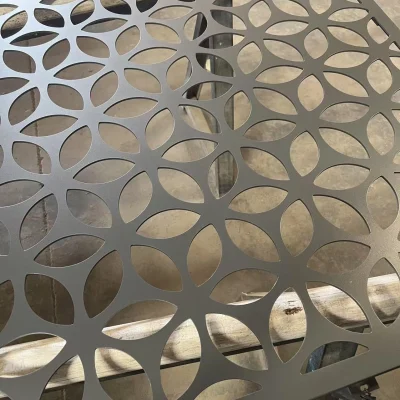 Close-up of aluminium carved panel in metallic grey showing geometric pattern design