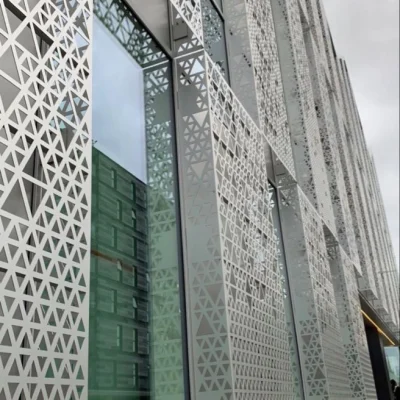 Installed aluminium carved panel cut out in triangle shape as decorative facade cladding