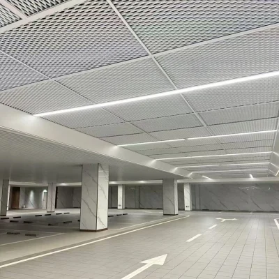 Showcase of expanded mesh installed as ceiling in undergrund parking