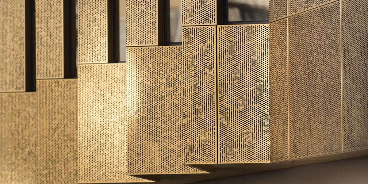 classic golden finish perforated panel with random array of holes